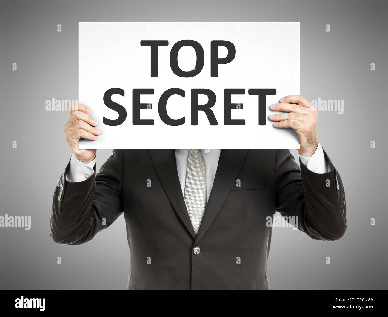 Imprenditore tenendo un cartello con la scritta Top Secret, Germania Foto Stock