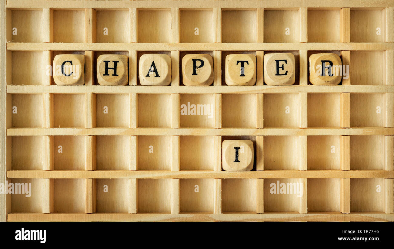Gioco in legno con la parola capitolo uno Foto Stock