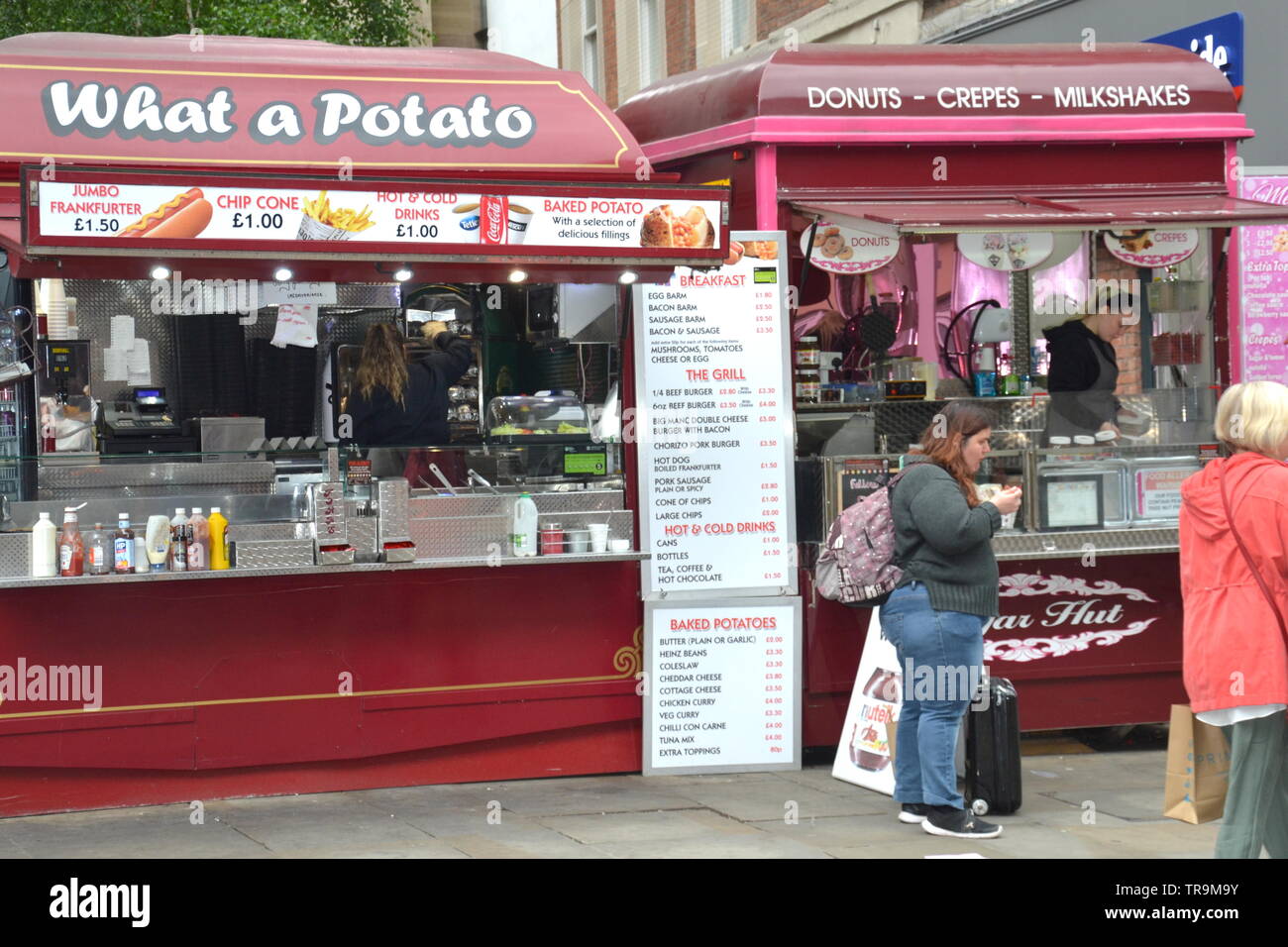 " Che cosa una patata " stallo alimentare in Market Street nel centro della città di Manchester, Regno Unito Foto Stock