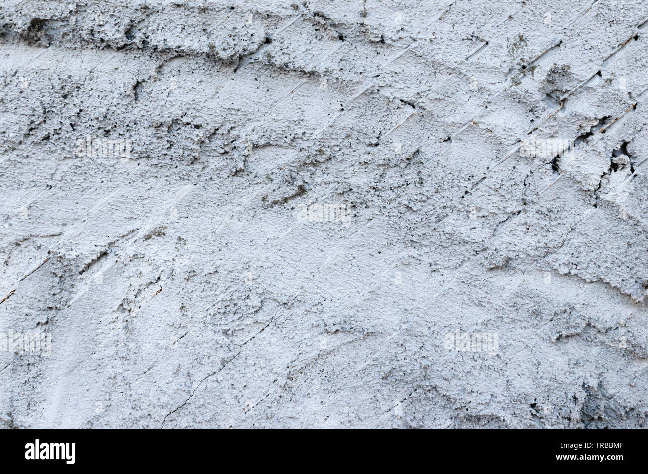 Sfondo di colore grigio sovrapposta casualmente in calcestruzzo. Foto Stock