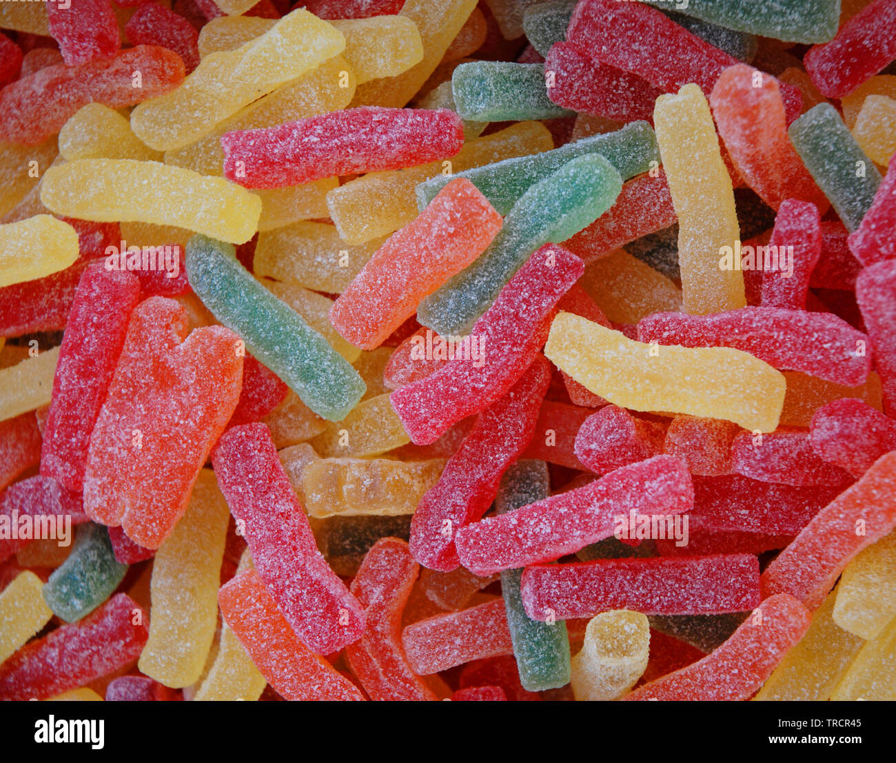Zuccherini colorati candy, vari dolci caramelle sfondo Foto stock - Alamy