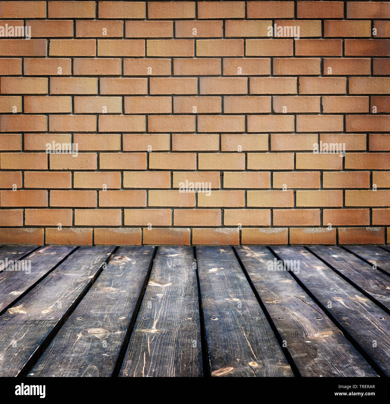 Sfondo con un muro di mattoni e pavimento in legno Foto Stock