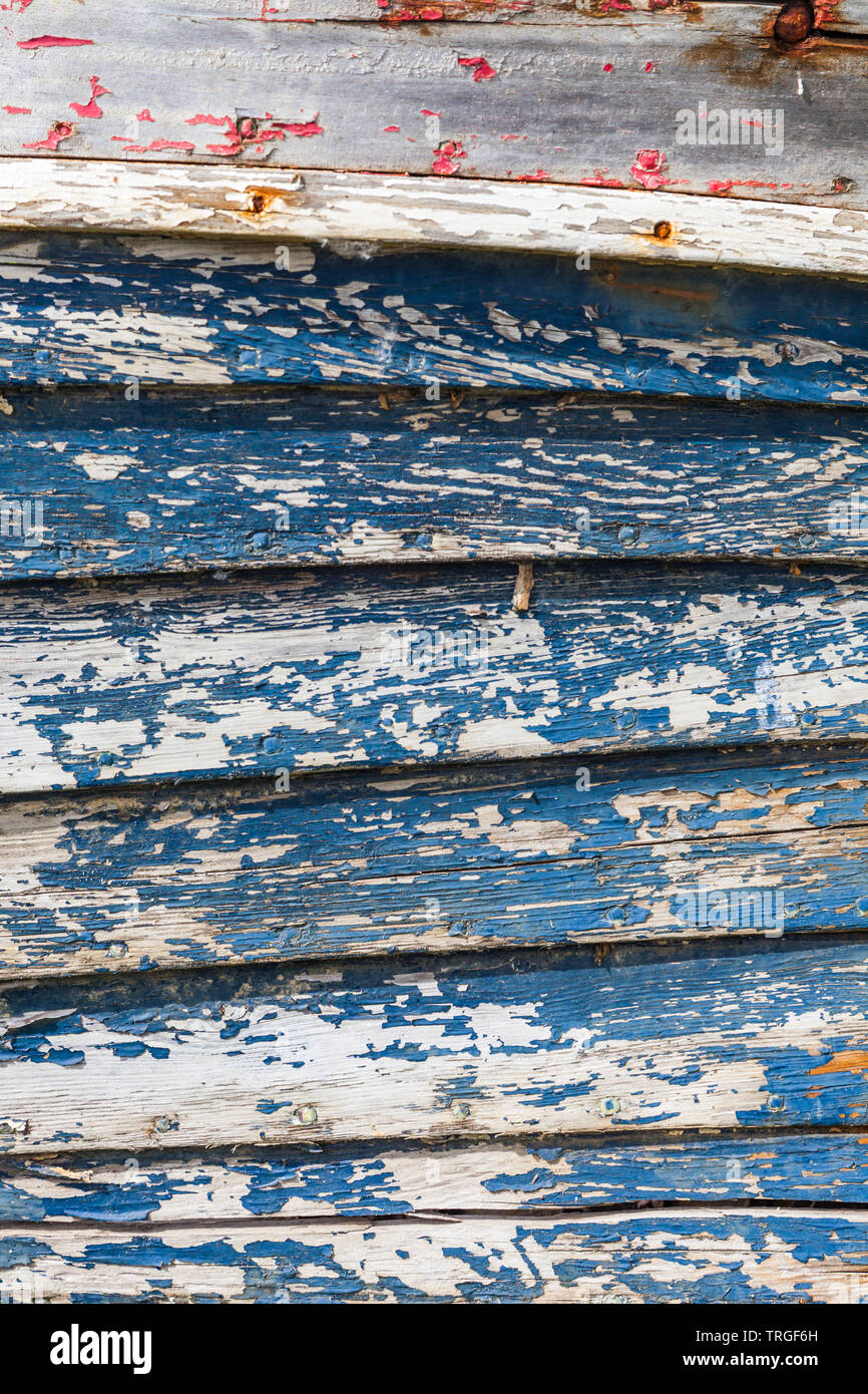 Immagine astratta di weathered listelli di legno di un clinker costruzione in legno dinghy in Steveston della Columbia britannica in Canada Foto Stock