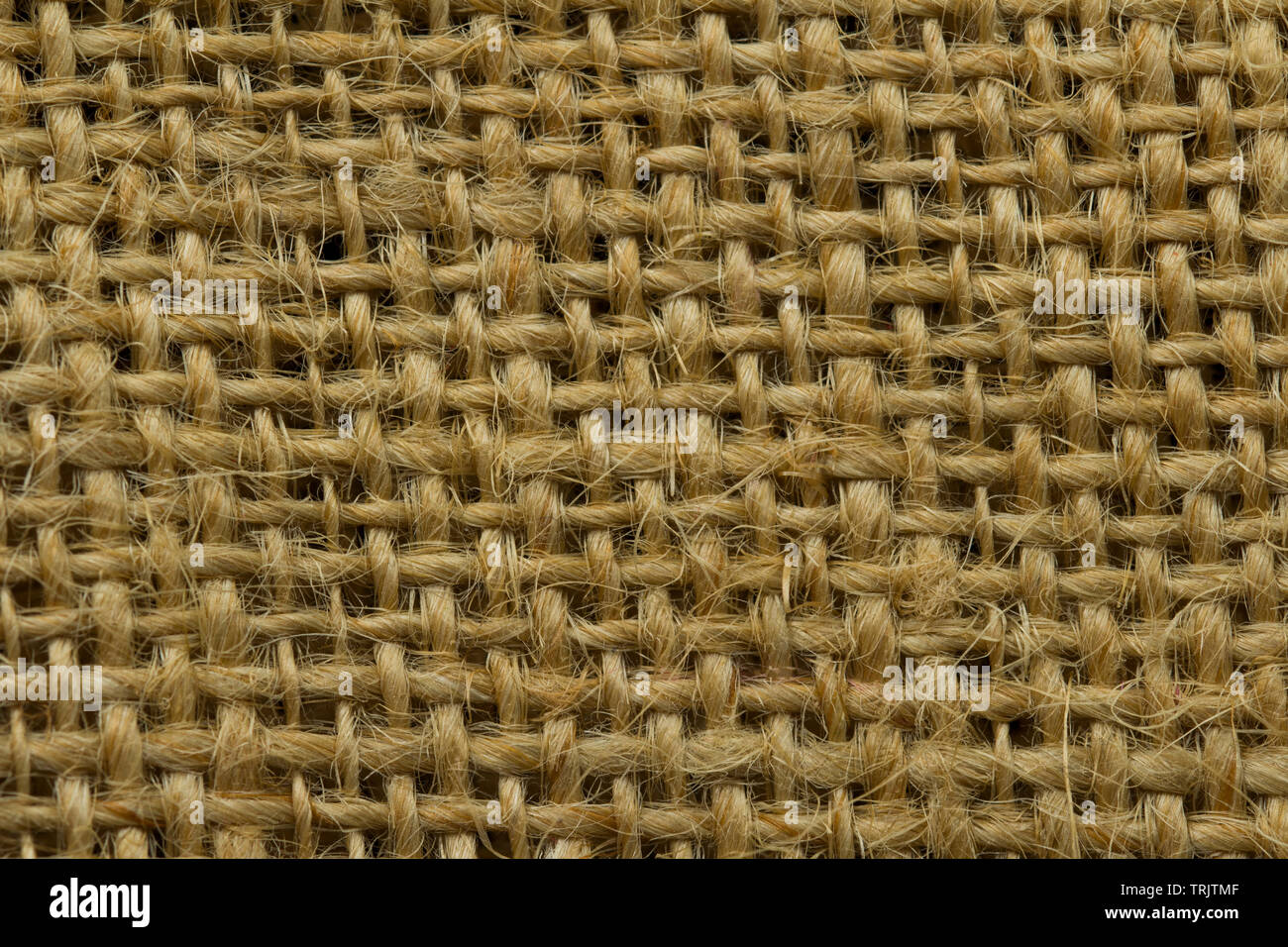 Grunge Sfondo della texture tessili. Dark naturale biancheria ruvida consistenza per lo sfondo. Tessuto di lino a trama bag.saccheggi sullo sfondo Foto Stock