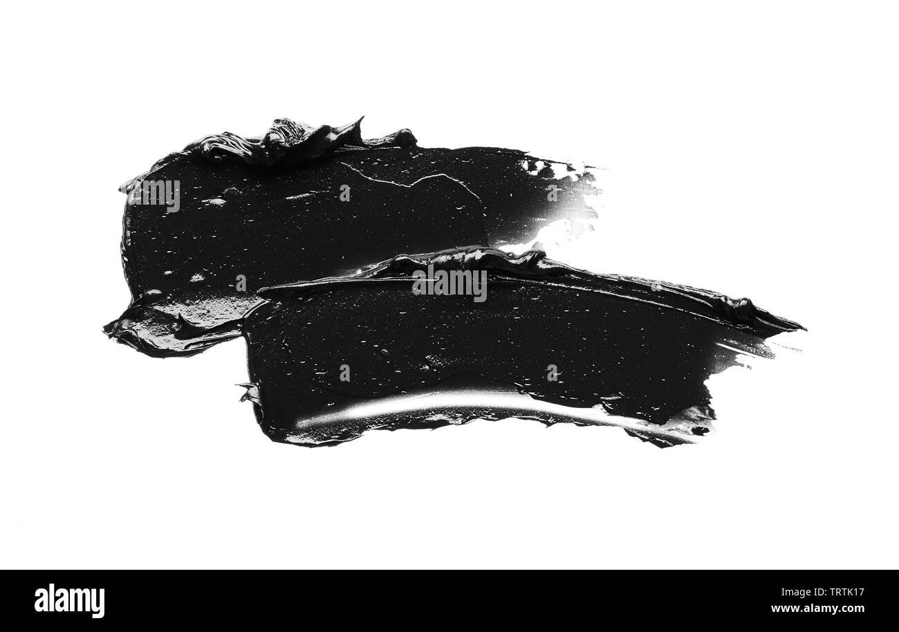 La texture di nero schiacciato eyeliner o vernice a base acrilica nera isolati su sfondo bianco Foto Stock