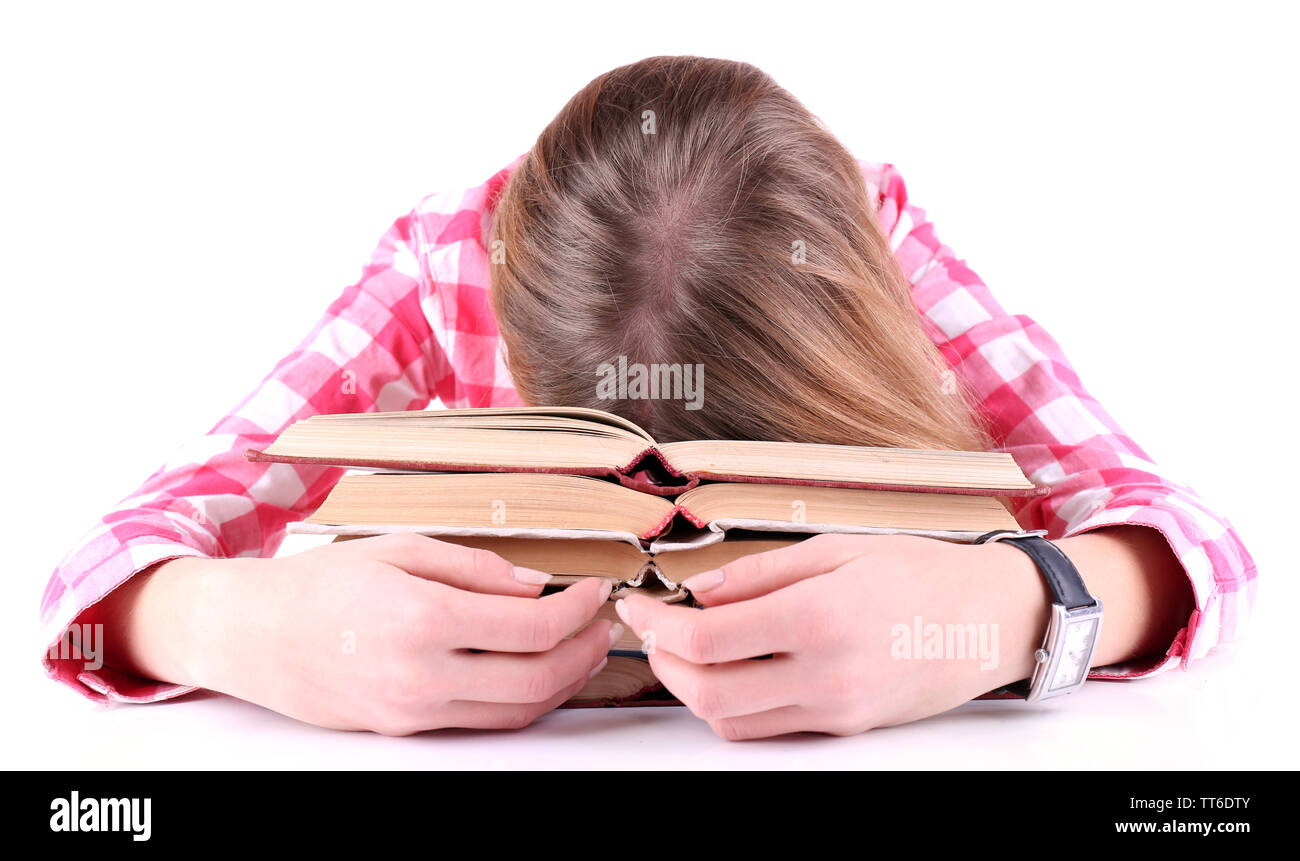 La ragazza si è addormentato per libri isolato su bianco Foto Stock