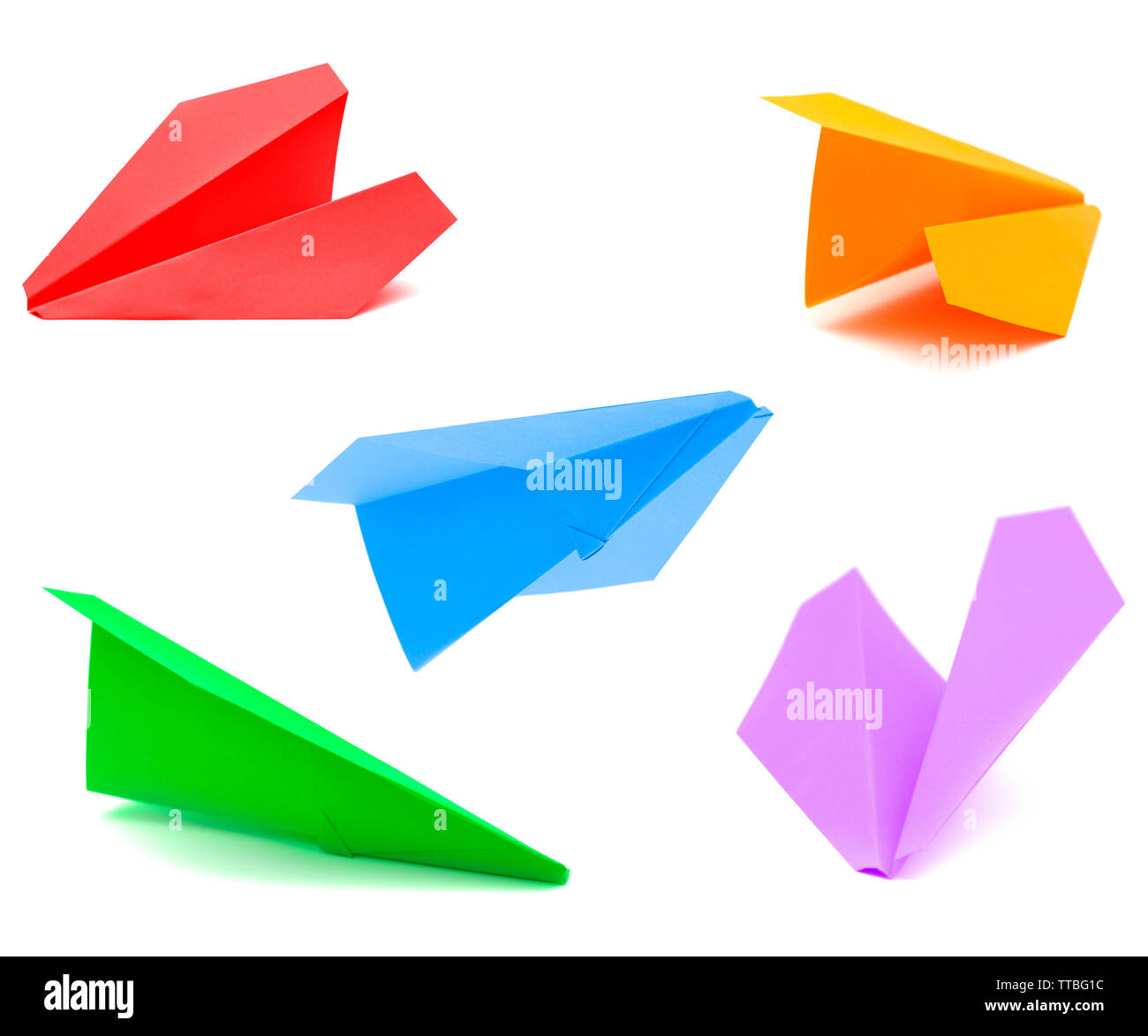 Aeroplano di carta fatta di carta a colori isolati su bianco Foto Stock