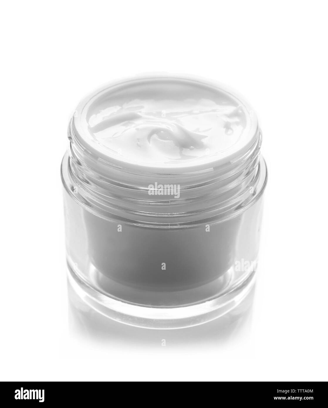 Ciotola di vetro di crema per il viso isolato su bianco Foto Stock