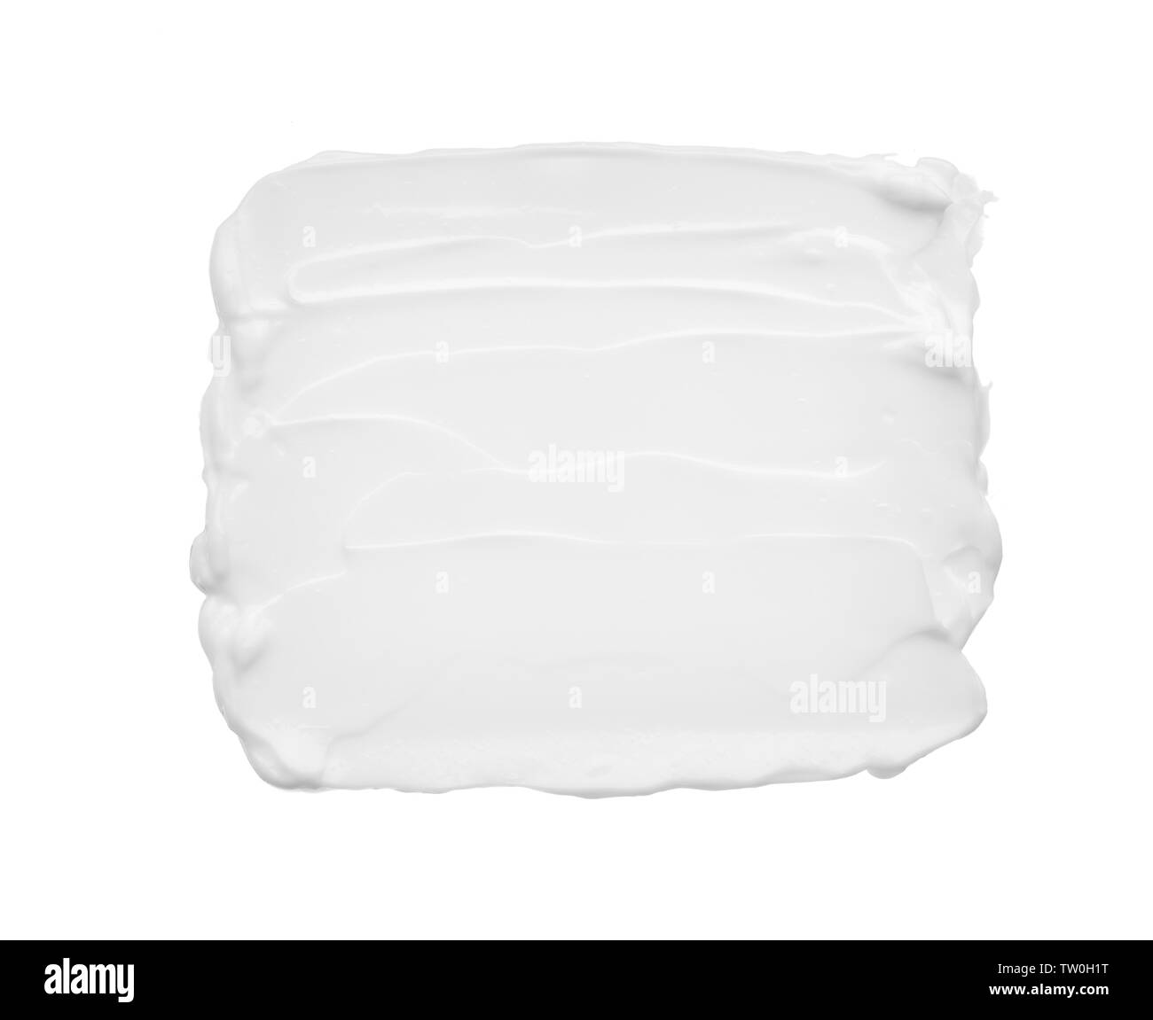 Macchie e consistenza di crema per il viso o bianco vernice acrilica isolati su sfondo bianco Foto Stock