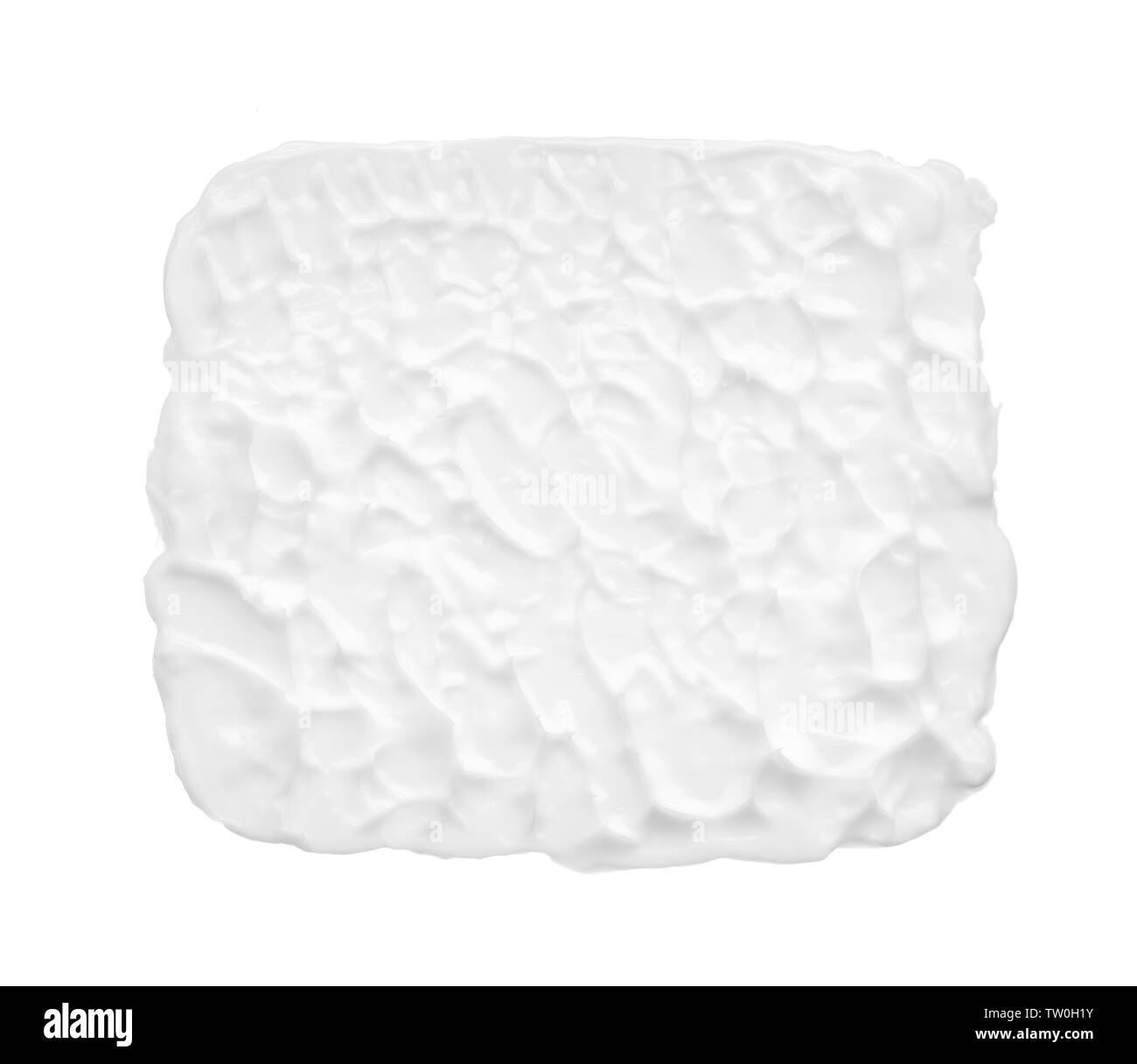 Macchie e consistenza di crema per il viso o bianco vernice acrilica isolati su sfondo bianco Foto Stock