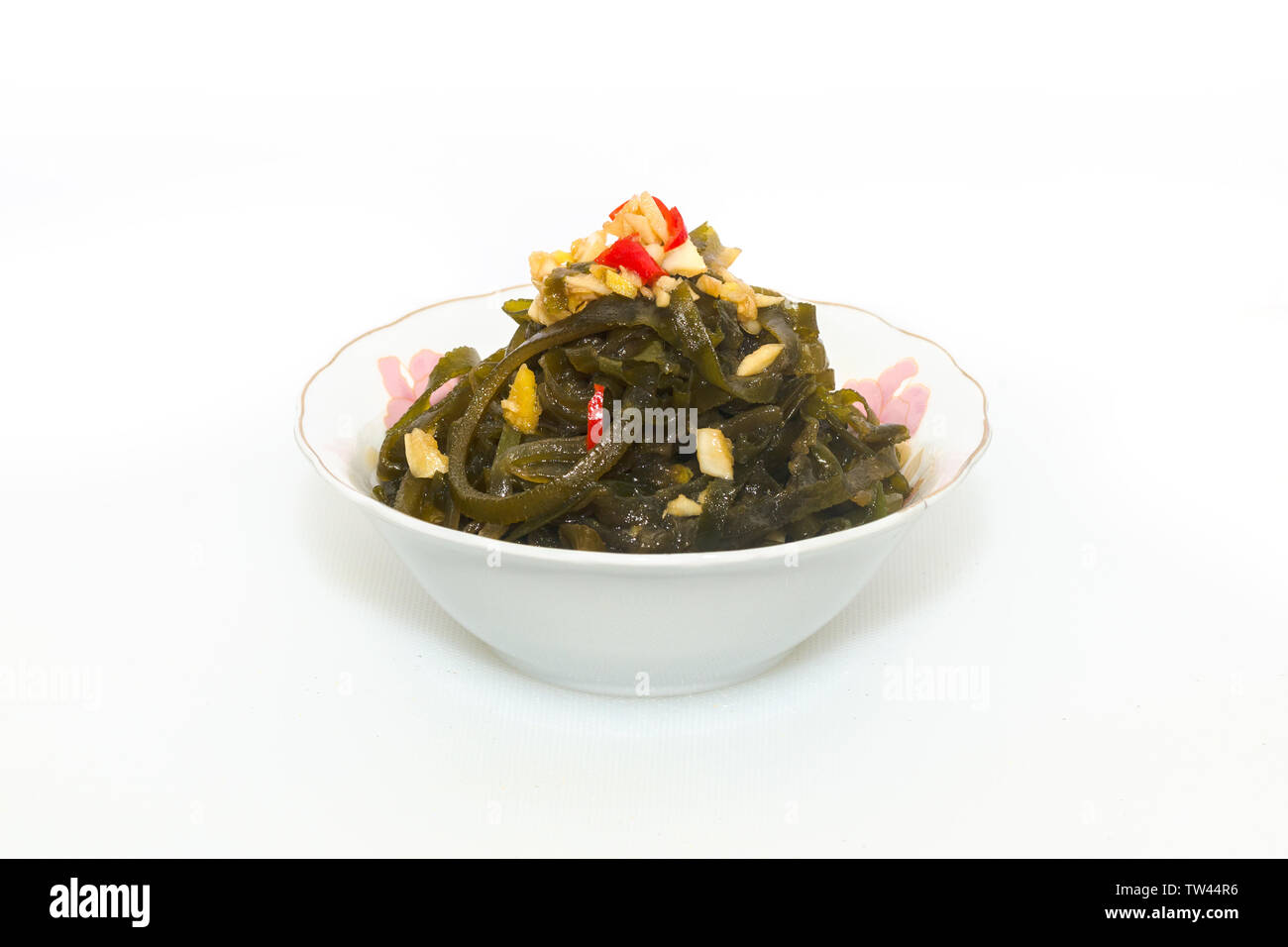 Il freddo kelp seta in un colore bianco porcellana ciotola Foto Stock