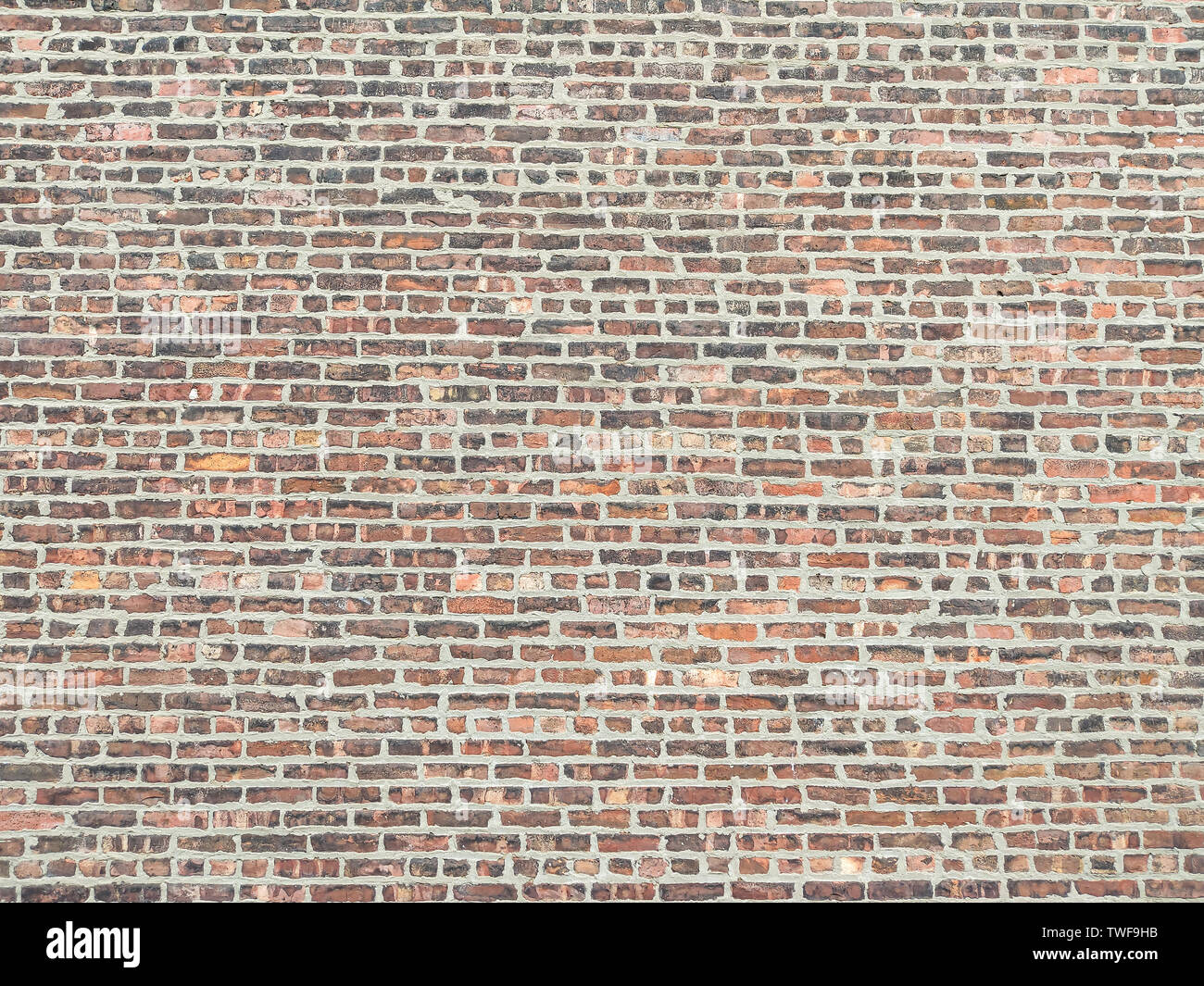 Muro di mattoni in background e texture. Rosso marrone colore dei mattoni costruito a parete, invecchiato, vintage facciata di edificio, tracciato orizzontale Foto Stock