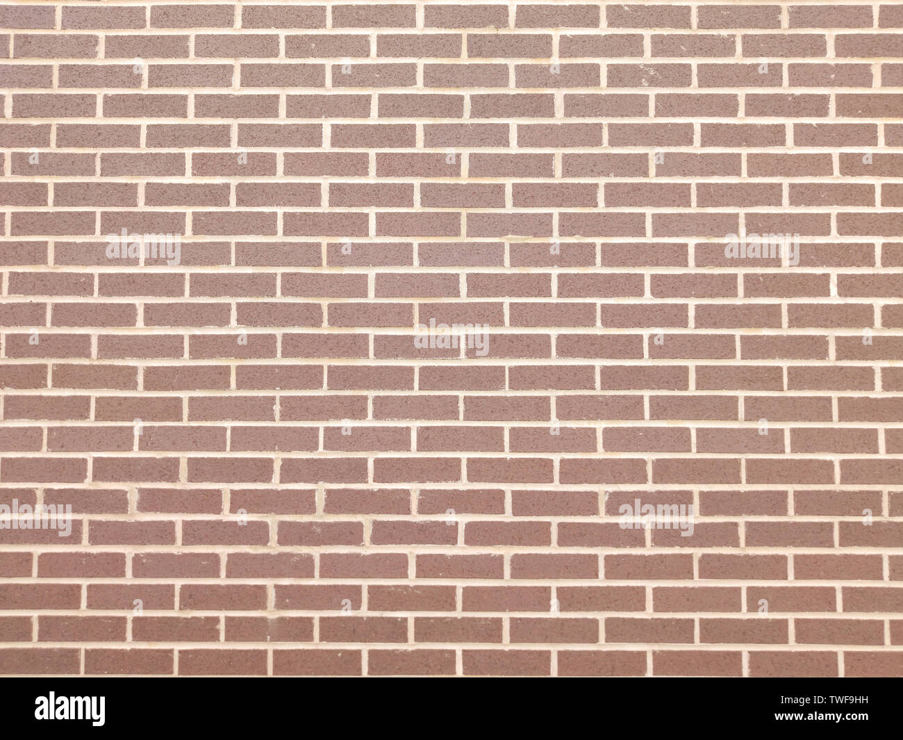 Muro di mattoni in background e texture. Rosso marrone colore dei mattoni costruito a parete, facciata di edificio, tracciato orizzontale Foto Stock