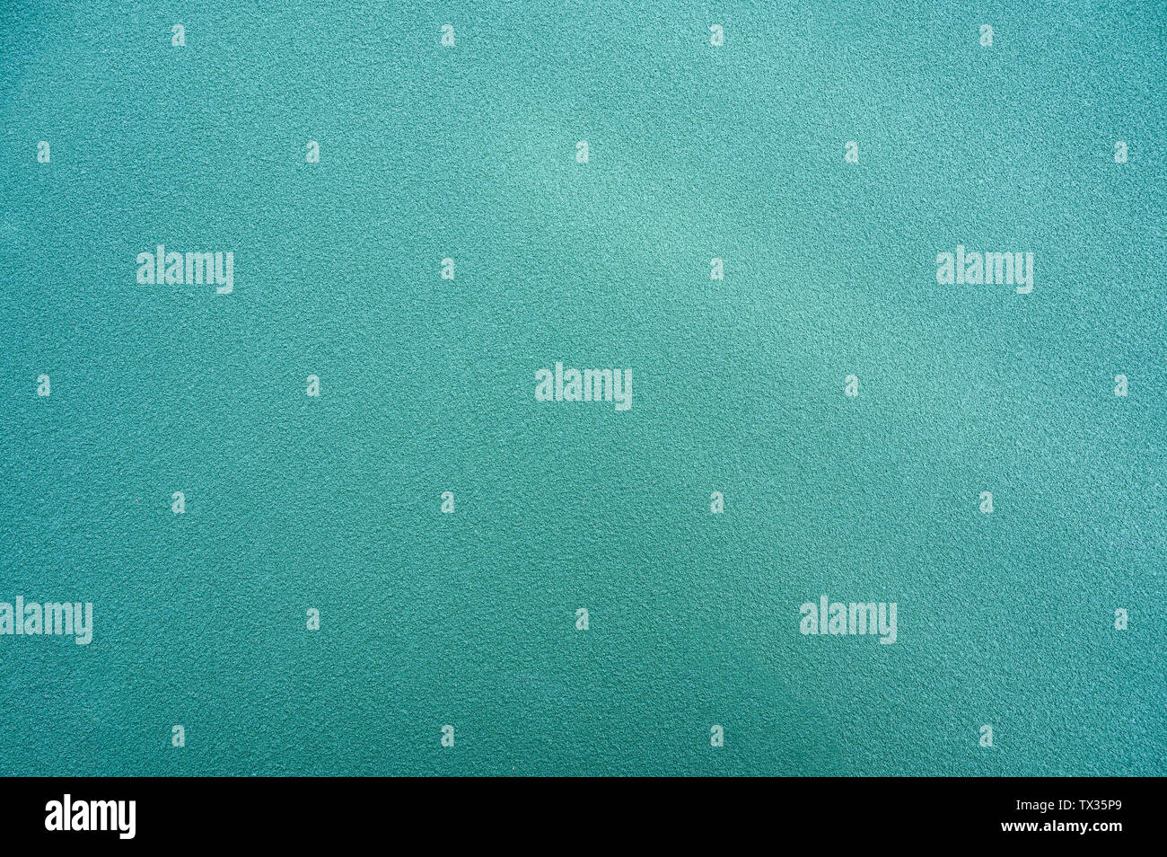 La texture verde gomma sintetica Campo di tennis sfondo Foto Stock