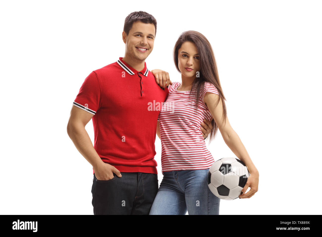 Giovane maschio e femmina in posa con un calcio isolati su sfondo bianco Foto Stock
