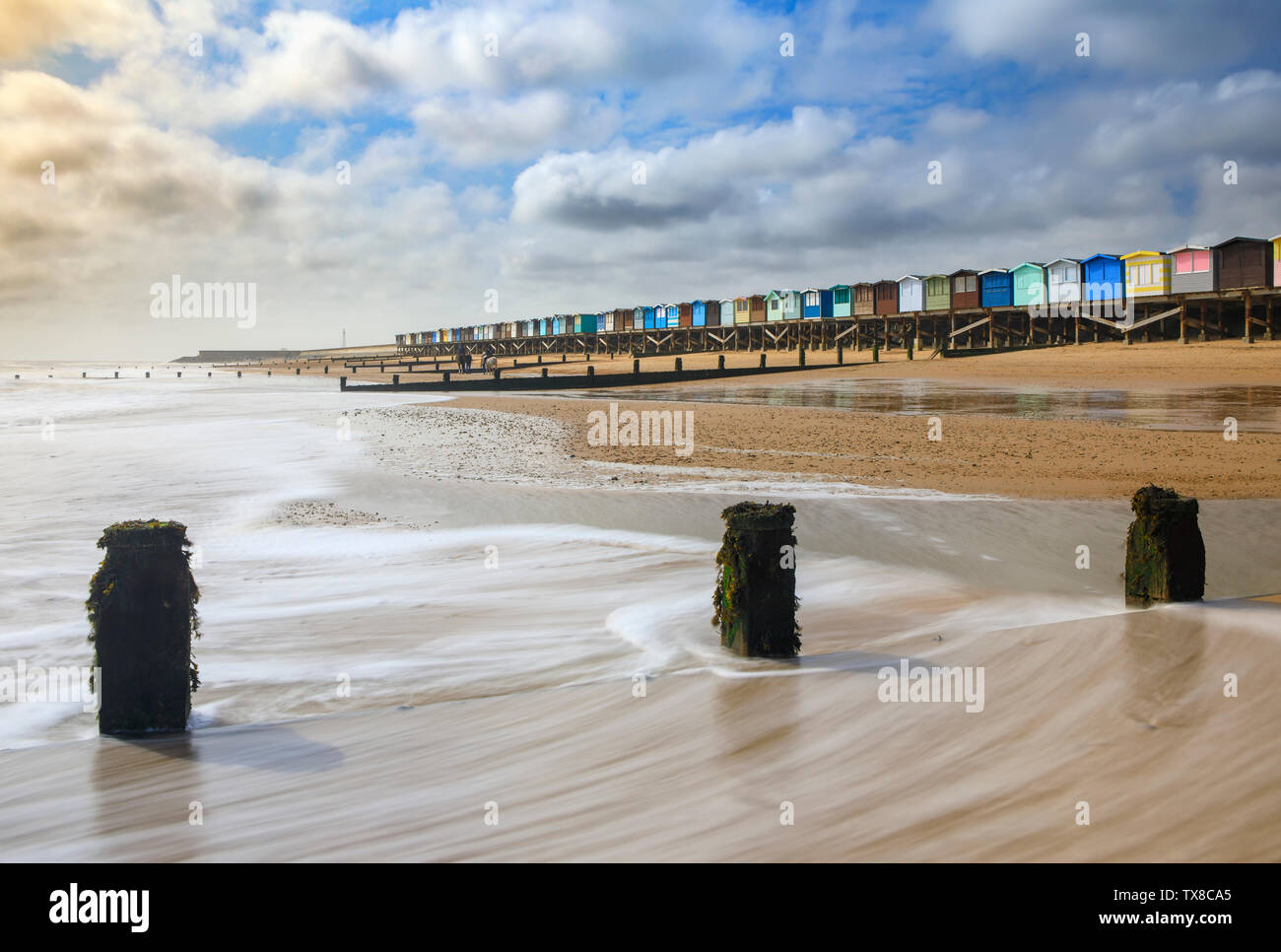 Pennelli e cabine ar Frinton on-mare in Essex Foto Stock