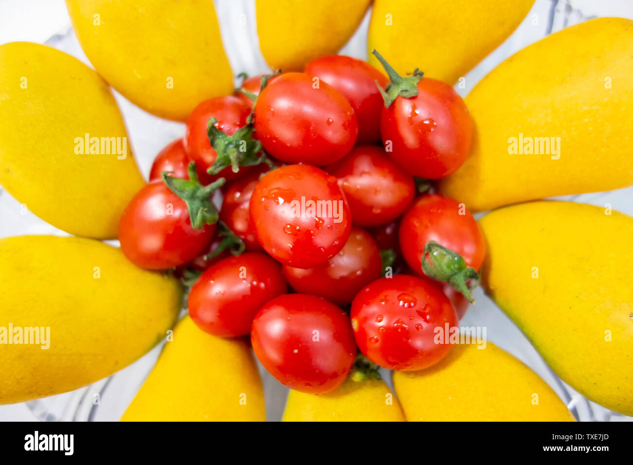 Mango e pomodorini Foto Stock