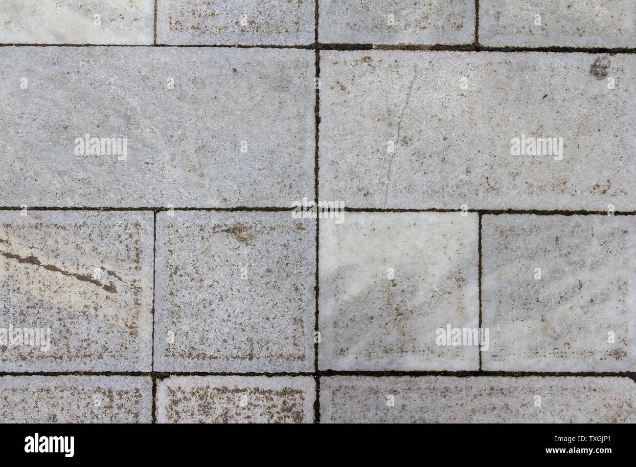 Piastrelle di calcestruzzo texture. Città sullo sfondo della pavimentazione. Pietra astratta brick pattern. Street sidewalk texture. Foto Stock