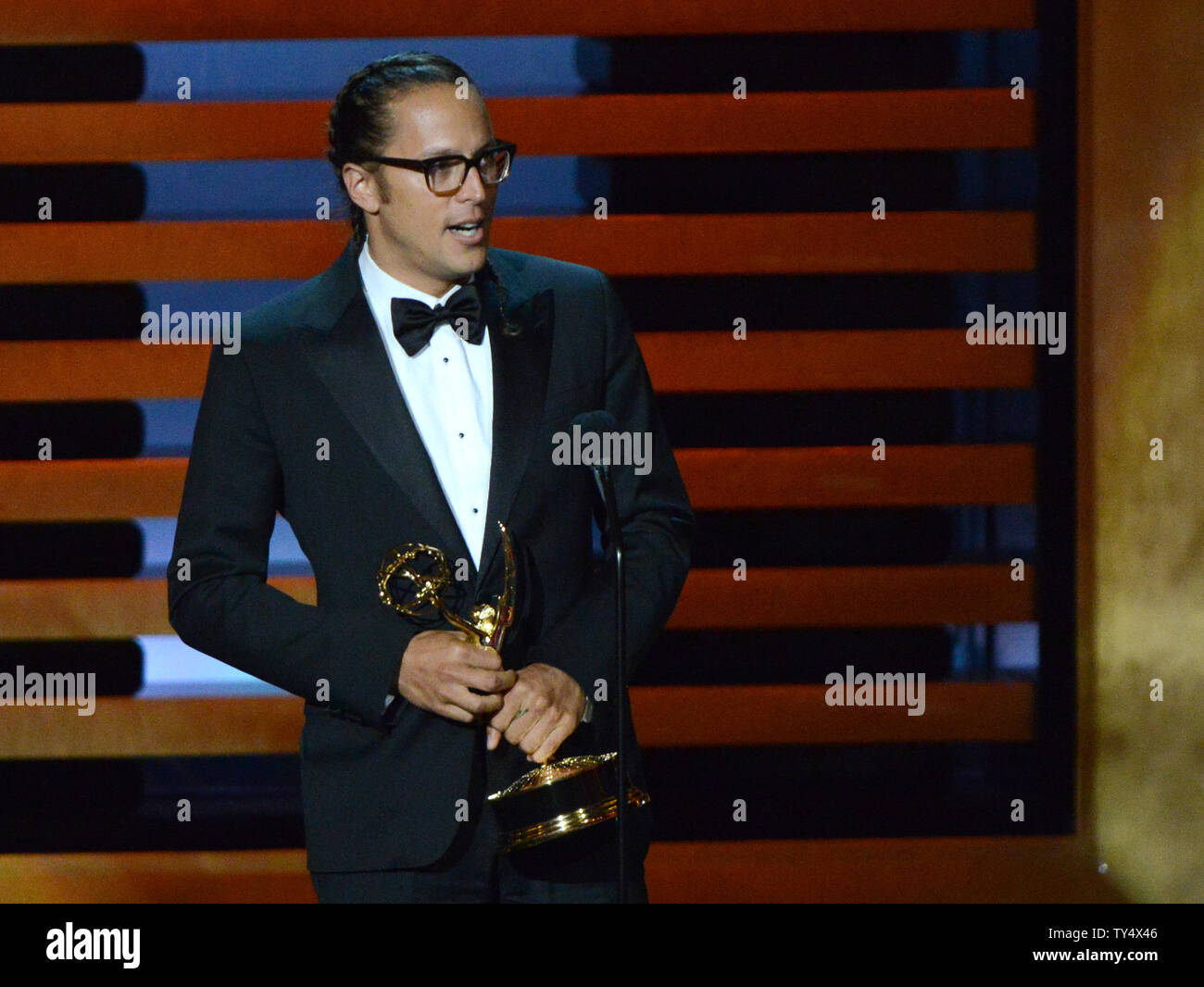 Cary Fukunaga accetta il premio per il miglior regia per una serie di dramma per il suo lavoro su "vero detective' - 'chi ci va' durante il Primetime Emmy Awards presso il Nokia Theatre di Los Angeles il 25 agosto 2014. UPI/Pat Benic Foto Stock