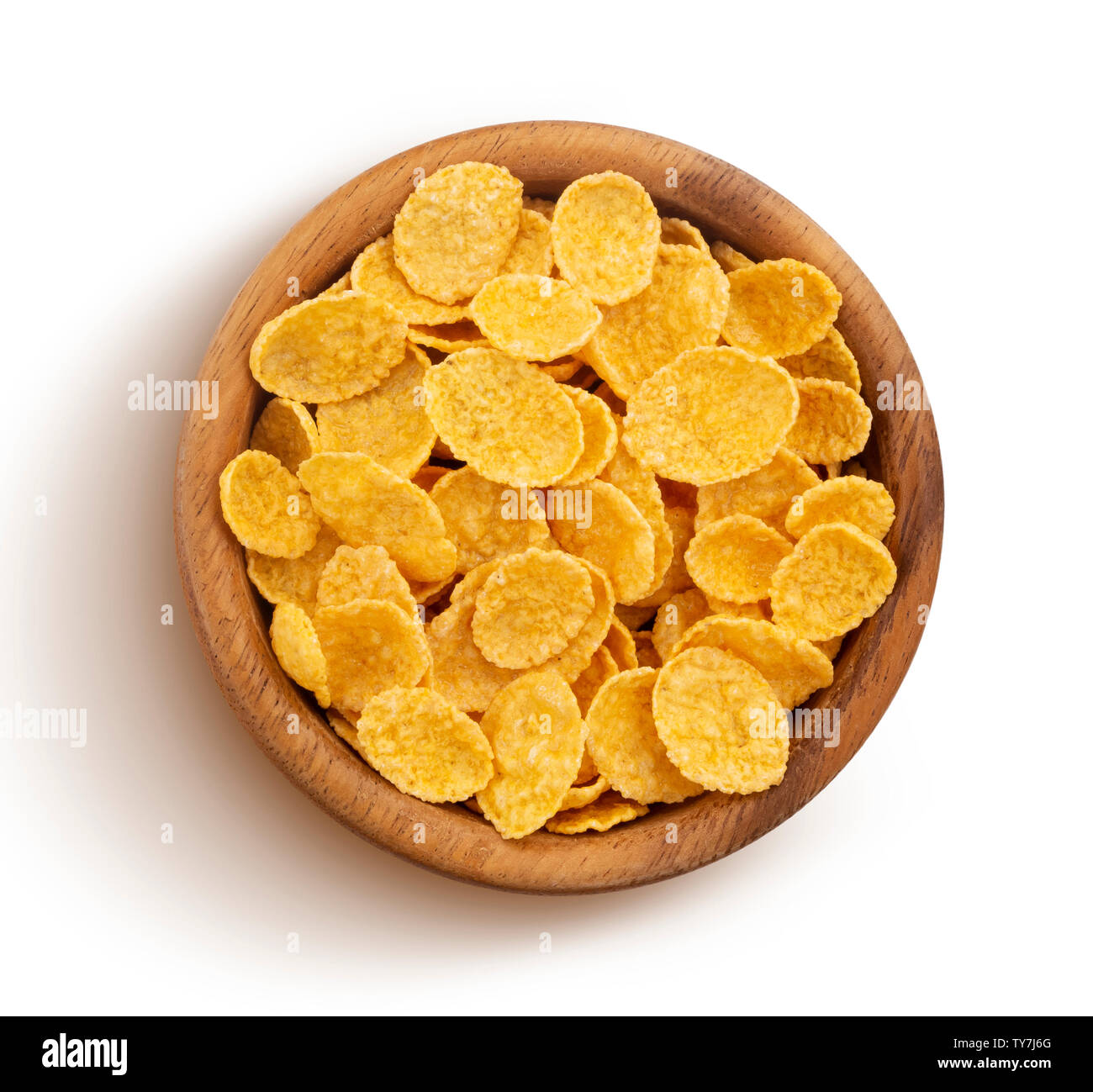 Fiocchi di mais in ciotola di legno isolato su sfondo bianco, vista dall'alto Foto Stock