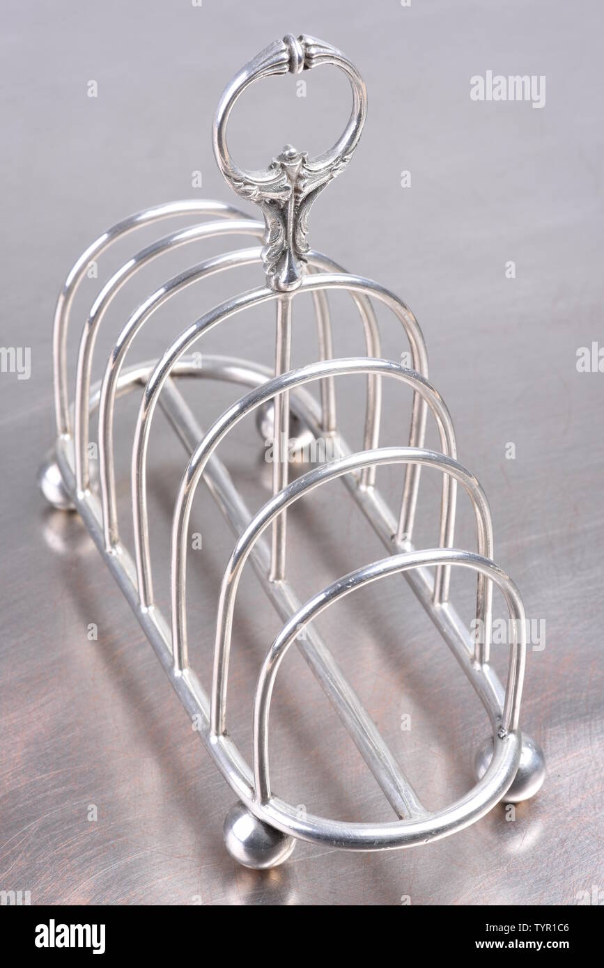 Argento antico rack toast Foto Stock