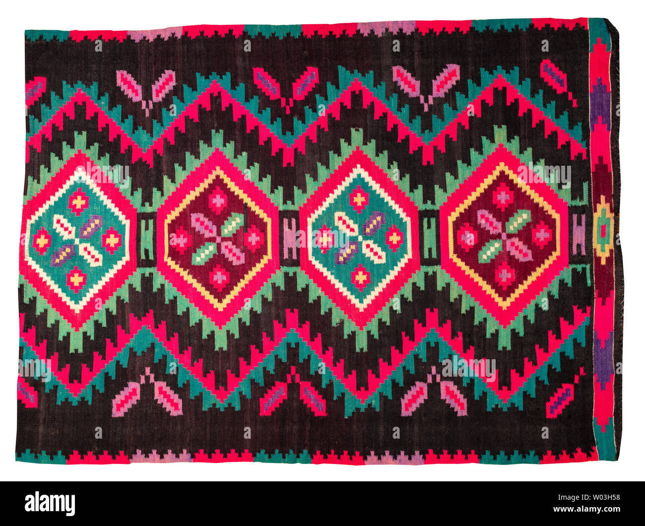 Vintage tappeto fatti a mano con forme geometriche e motivi tradizionali della regione Maramures della Romania su uno sfondo bianco. Foto Stock