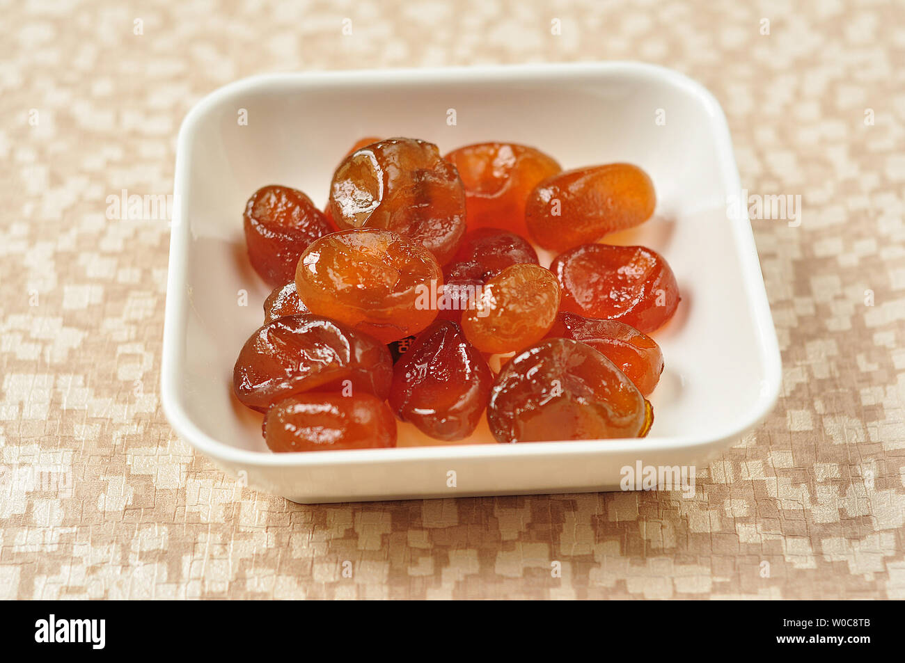 Kumquat canditi Foto Stock