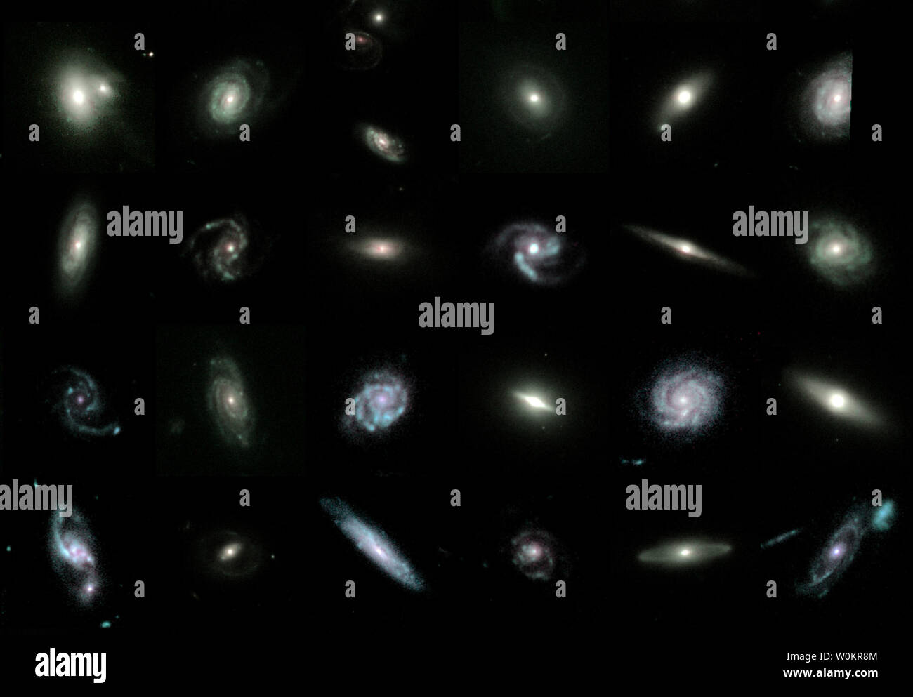 Questa è una sezione ritagliata di un telescopio spaziale Hubble mosaico di 80 luminose galassie dalle gemme sondaggio, e illustra la diversità delle diverse forme di Galaxy, dimensioni e tipi: anguria a forma di galassie ellittiche, maestose le galassie a spirale, alcuni con barre allungate nei loro centri, e spettacolare galassia fusioni. Il mosaico appare nove miliardi di anni nel passato, quando l'universo è stato appena un terzo la sua età attuale. Le gemme sondaggio sta per evoluzione di Galaxy dalla morfologia e distribuzione spettrale di energia ed è finalizzato a una migliore comprensione della natura delle galassie. (UPI foto/Hubble Foto Stock