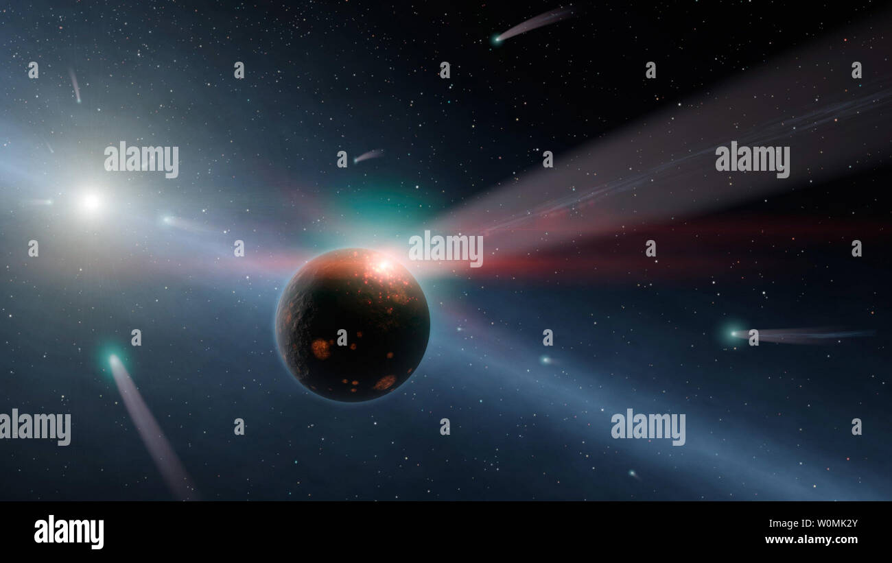 Questo artista della concezione illustra una tempesta di comete intorno ad una stella denominata Eta Corvi. Prova di questo barrage proviene dalla NASA il telescopio spaziale Spitzer, la cui rilevatori ad infrarossi captato indicazioni del fatto che uno o più comete è stato recentemente sbrindellata dopo la collisione con un corpo roccioso. UPI/NASA/JPL-Caltech Foto Stock