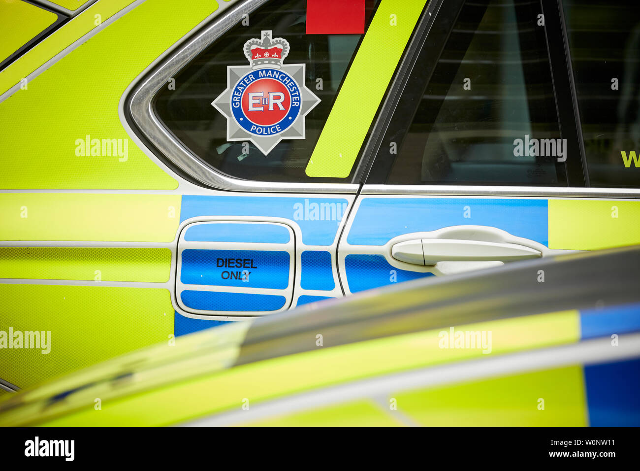 Il centro della città di Manchester, polizia armata BMW 4x4 livrea auto della polizia Foto Stock