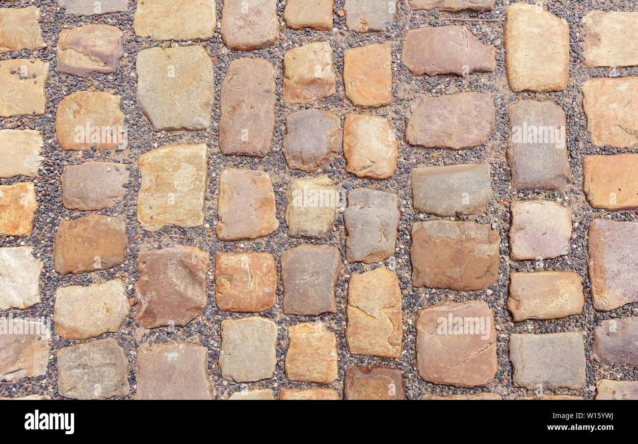 Vecchia strada in ciottoli di grosse pietre. Foto Stock