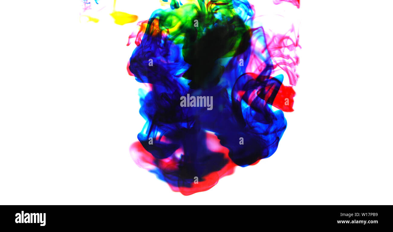 cmyk ink concept color splash for paint / Rainbow ink drop Acrylic colors in water on white background , blur and selective focus Foto Stock