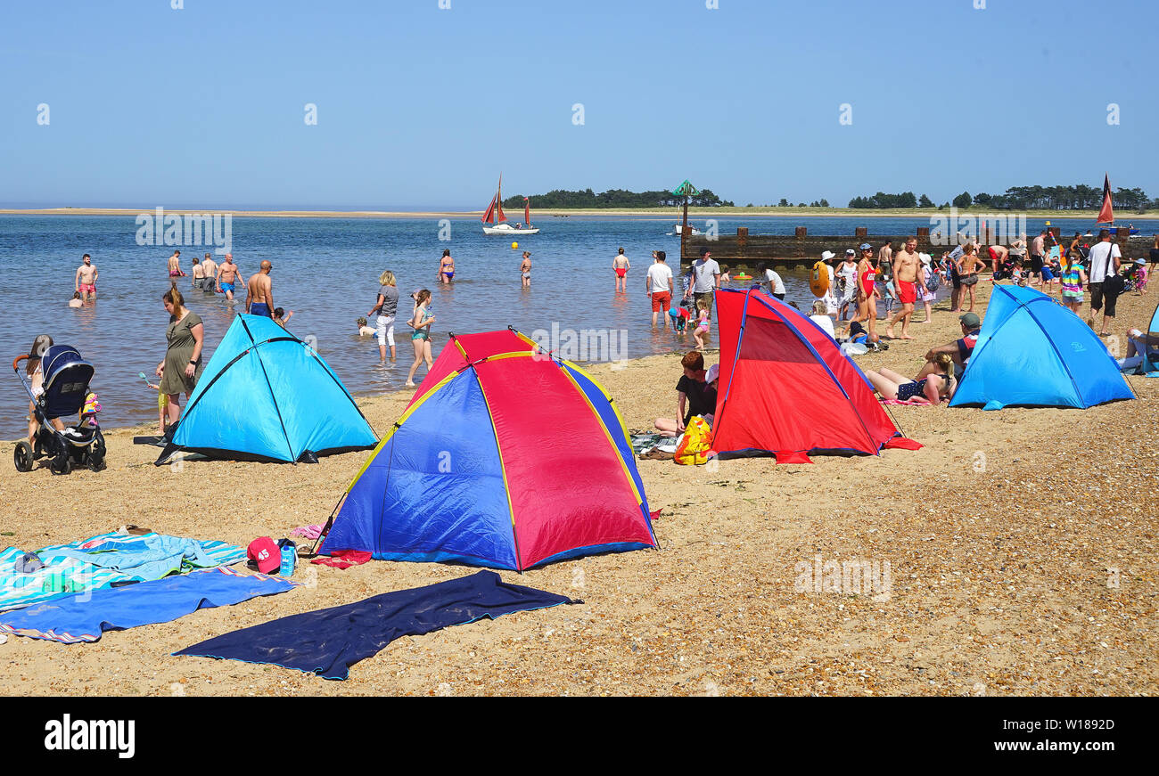 Rifugi in spiaggia sulla spiaggia a Wells-next-Mare Foto Stock