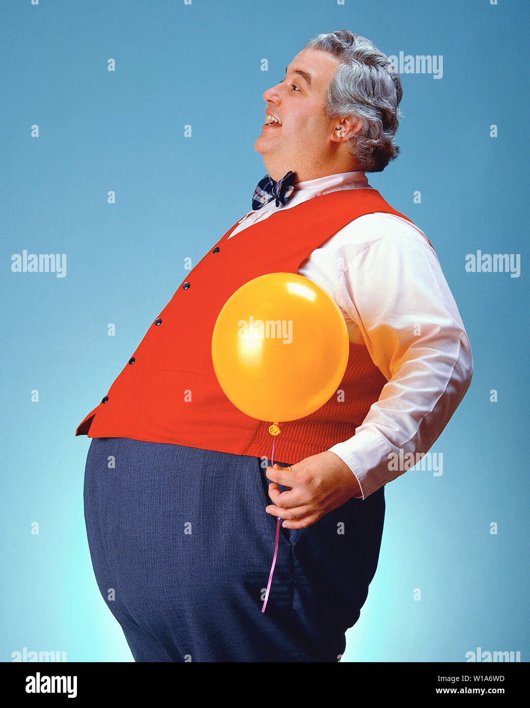Uomo grasso con un palloncino Foto Stock