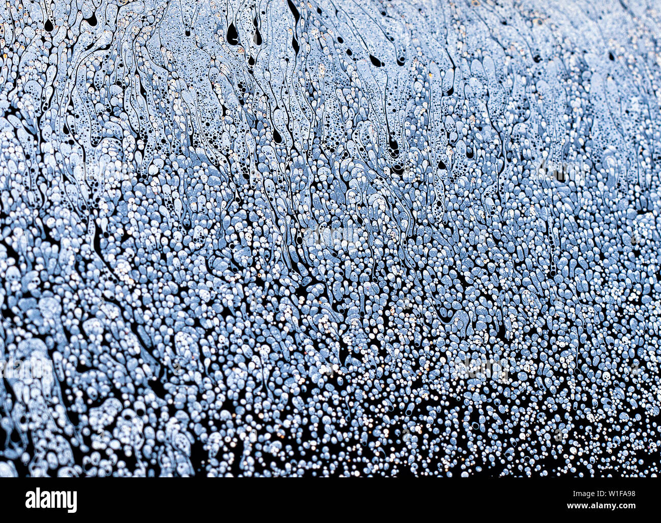 Incredibile fantasia acqua saponata pattern sfondo astratto semicerchio. Modello di spazio o di pianeti universo cosmic. Foto Stock