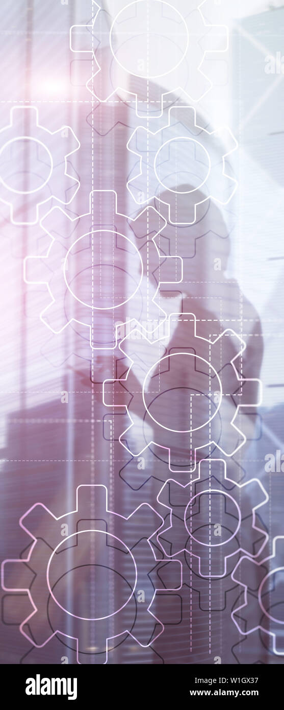 Panorama verticale Banner. Doppia esposizione meccanismo di ingranaggi su sfondo sfocato. Business e processo industriale il concetto di automazione Foto Stock