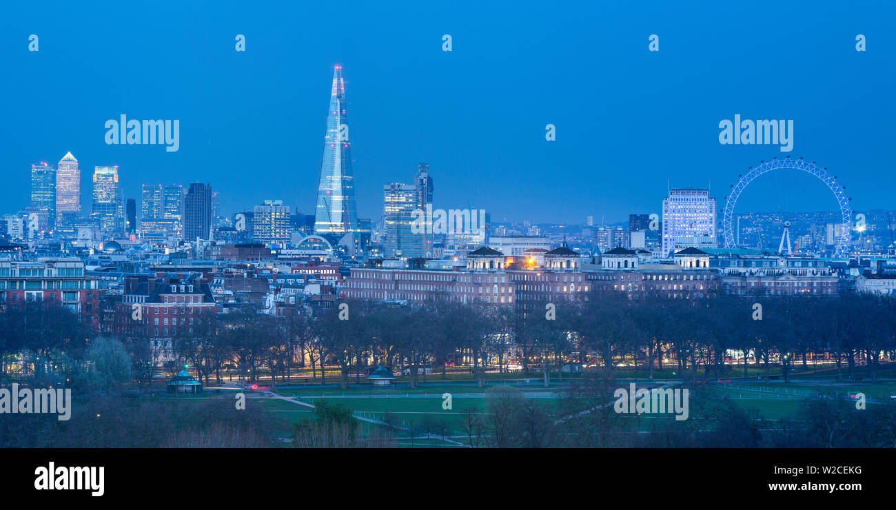 La Shard, Canary Wharf e il London Eye al di sopra di Hyde Park, London, England, Regno Unito Foto Stock