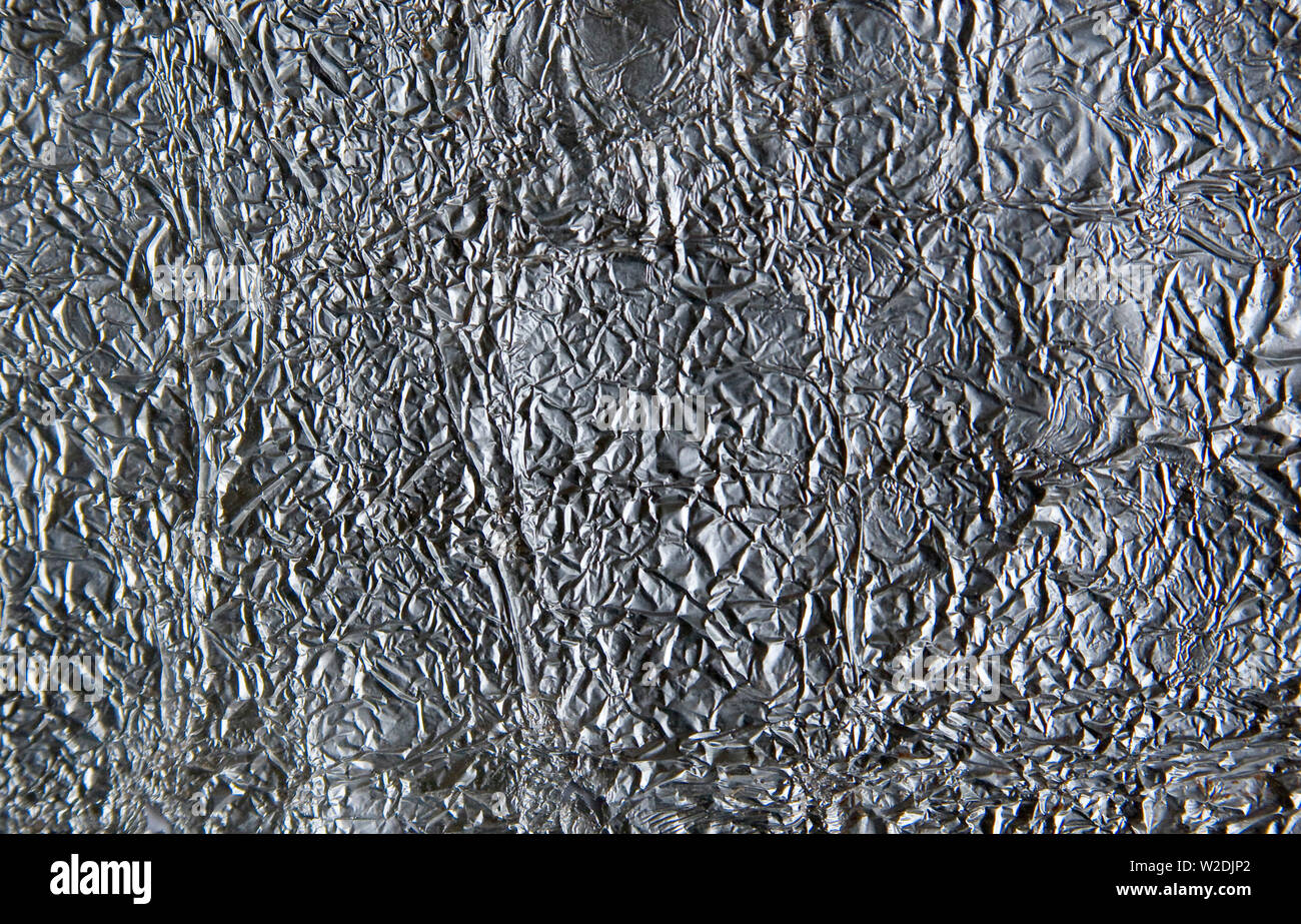Close up crumpled alluminio (alluminio) lamina. Foto Stock