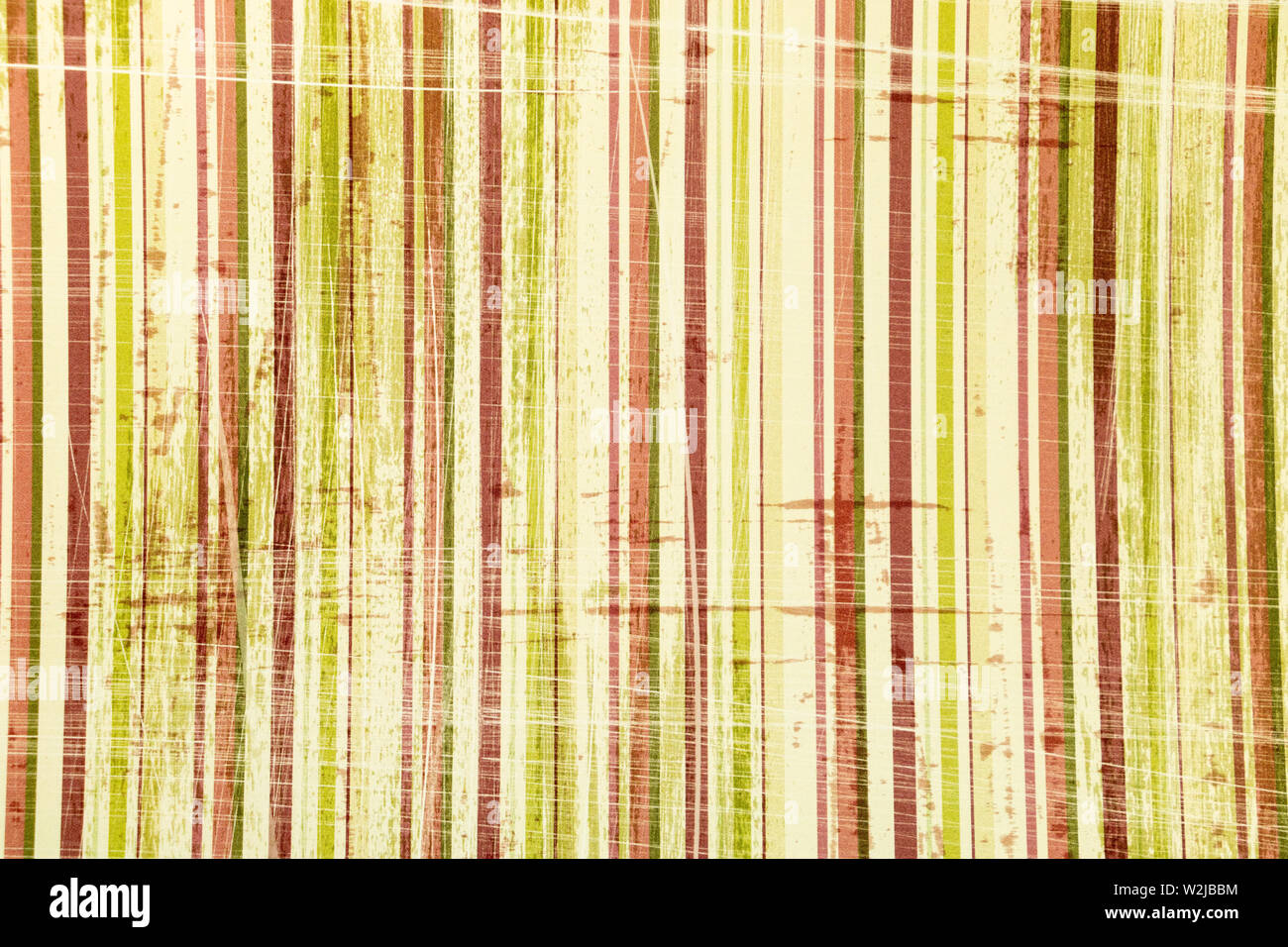 Risorse grafiche, parete dipinta in stile grunge colori verde pistacchio e striato rosso Foto Stock