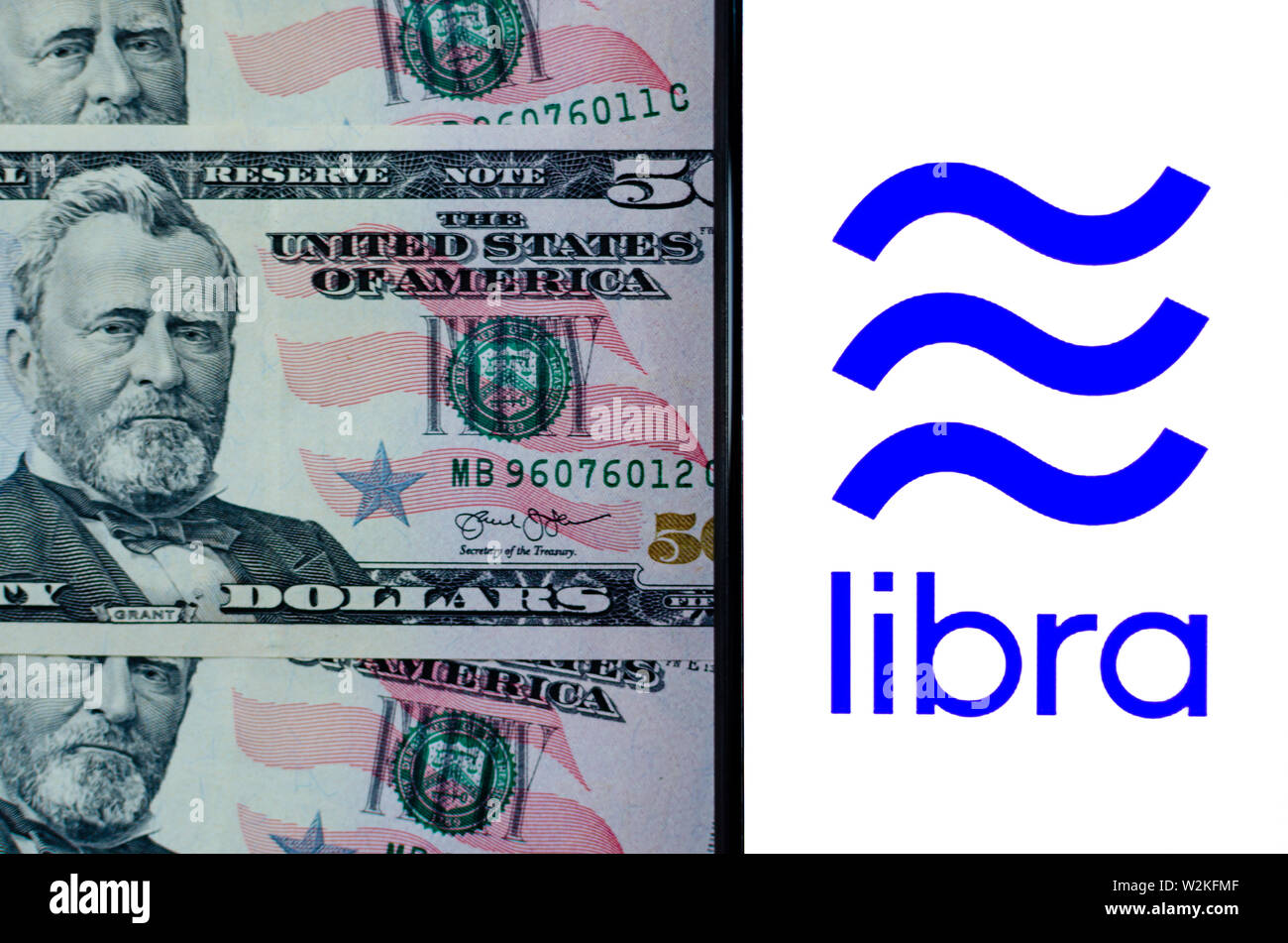 Facebook LIbra e 50 le fatture del dollaro. Foto che mettono in evidenza la somiglianza di Libra logo e il simbolo sul dollaro 50 banconote. Foto Stock