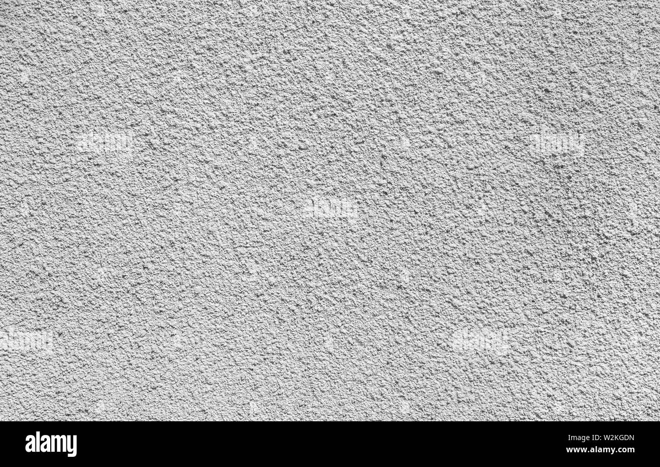 Intonacate e dipinte, ruvida e calcestruzzo bianco o muro di pietra in bianco e nero. Alta risoluzione full frame sfondo a trama. Foto Stock