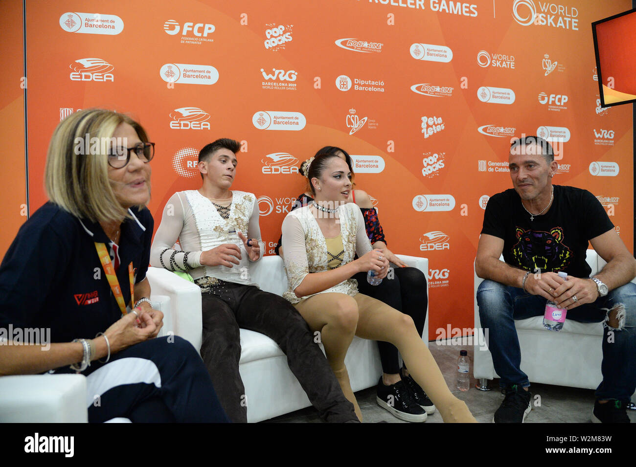 Barcellona, Spagna. 9 Luglio, 2019. MICOL MILLS-TOMMASO CORTINI dall'Italia, eseguendo in coppie Junior, lungo programma, hanno classificato in 1st. Posizione, a kiss & cry con Cristina Iolanda Pelli (sinistra) e Patrick Venerucci (lato destro), il mondo dei giochi a rullo 2019, a Palau Sant Jordi, sulla luglio 09, 2019 Barcellona, Spagna. Credito: Raniero Corbelletti/AFLO/Alamy Live News Foto Stock