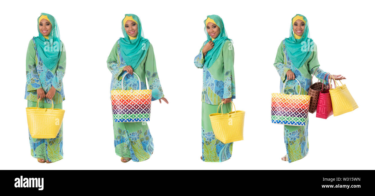 Set di asian muslimah donna in pieno lunghezza con un luminoso tote sacche isolate su sfondo bianco Foto Stock