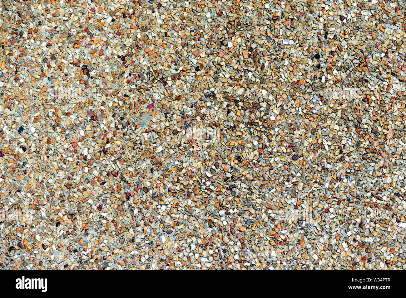 Pebble pavimento in pietra texture vicino. Sfondo astratto Foto Stock