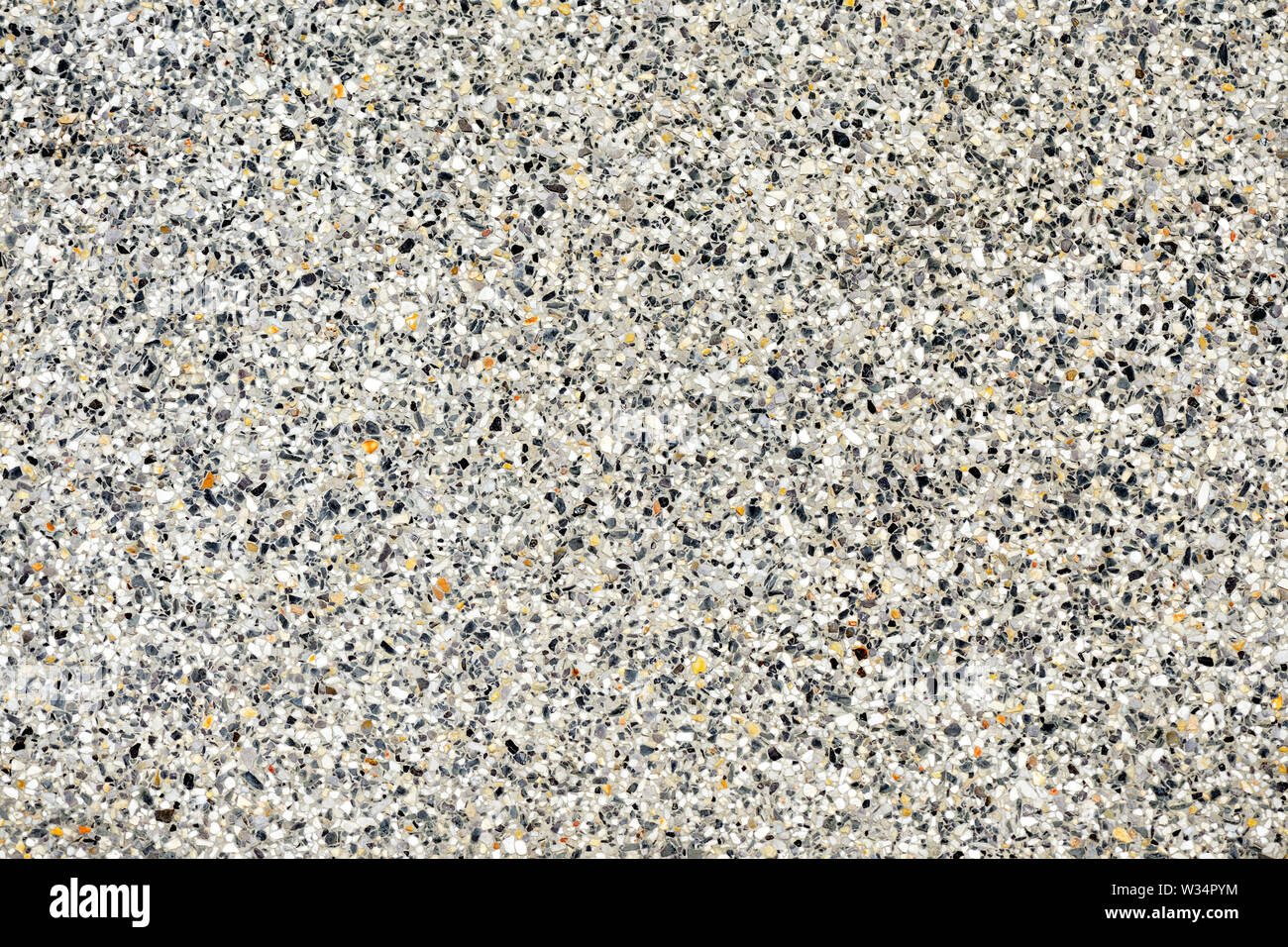 Pebble pavimento in pietra texture vicino. Sfondo astratto Foto Stock