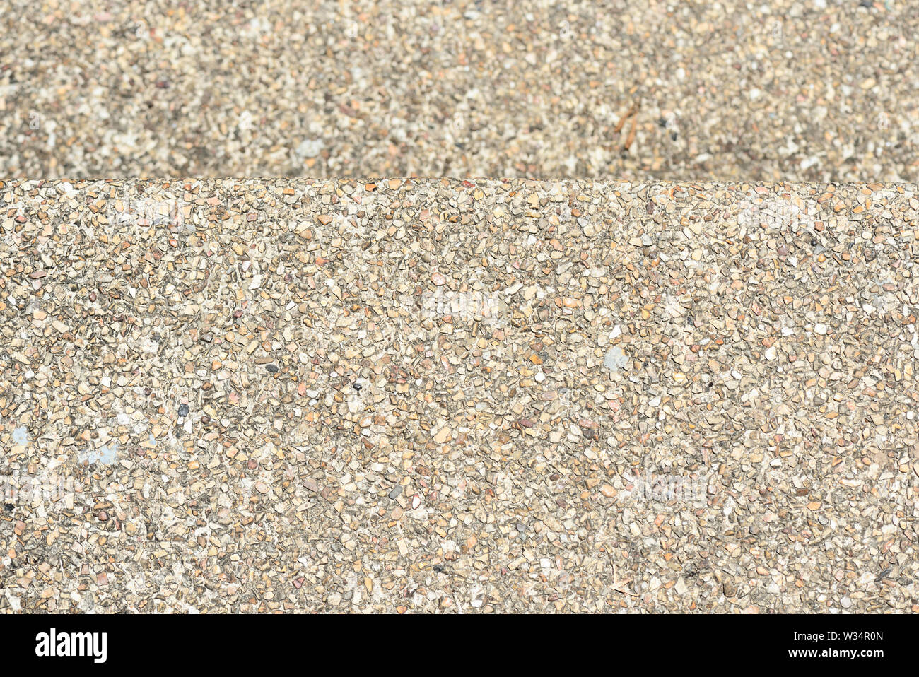 Pebble pavimento in pietra texture vicino. Sfondo astratto Foto Stock