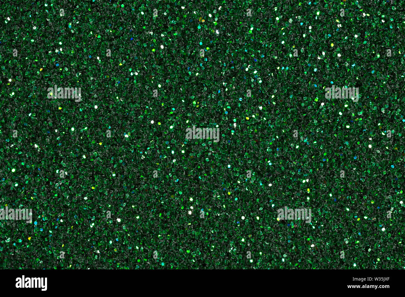 Sfondo verde scuro con glitter. Alta qualità texture in una risoluzione estremamente elevata. Foto Stock