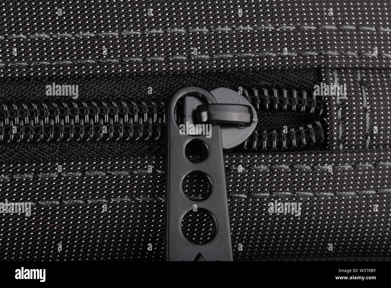 Borsa nera con puntini bianchi Foto Stock