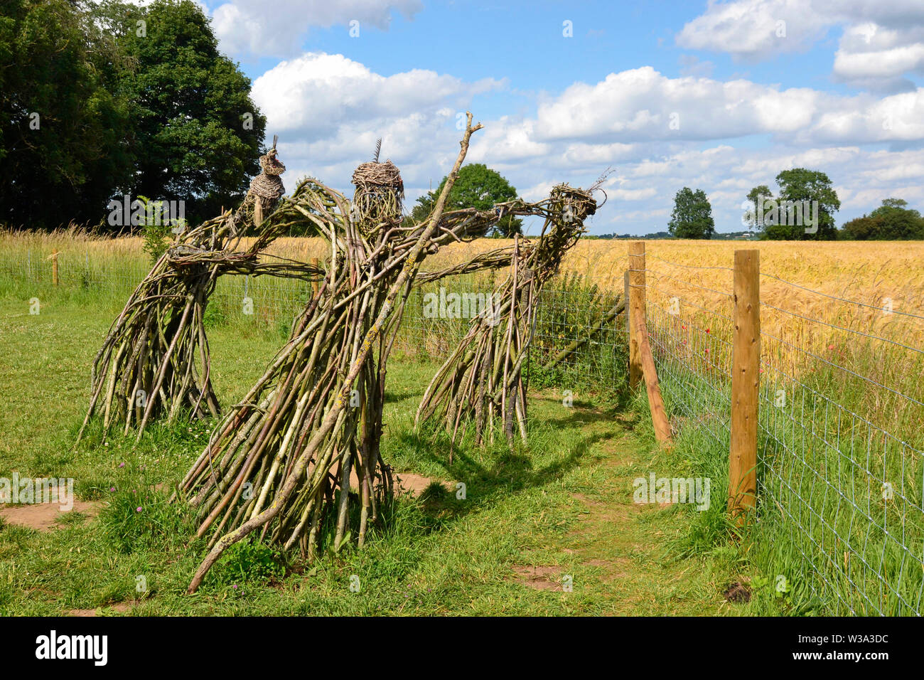 Fate tre sculture, gli uomini del re stone circle, Il Rollright Stones, Stone Court, grande Rollright, Chipping Norton, Oxfordshire, Regno Unito Foto Stock