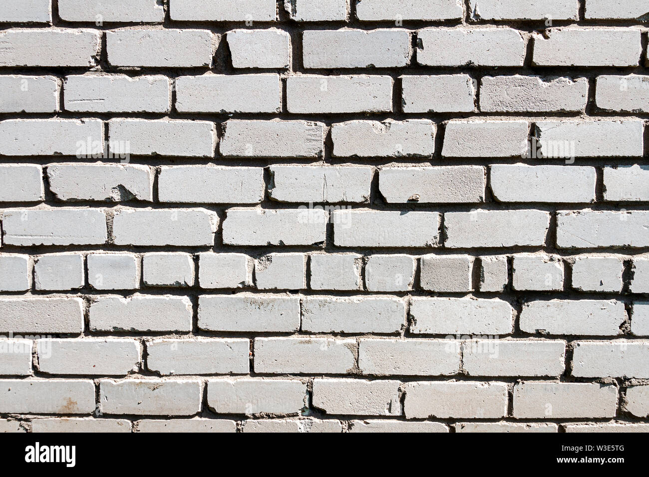Bianco vecchio muro di mattoni texture dello sfondo. Questa sorta di mattoni è molto comune nel post paesi sovietici. Foto Stock